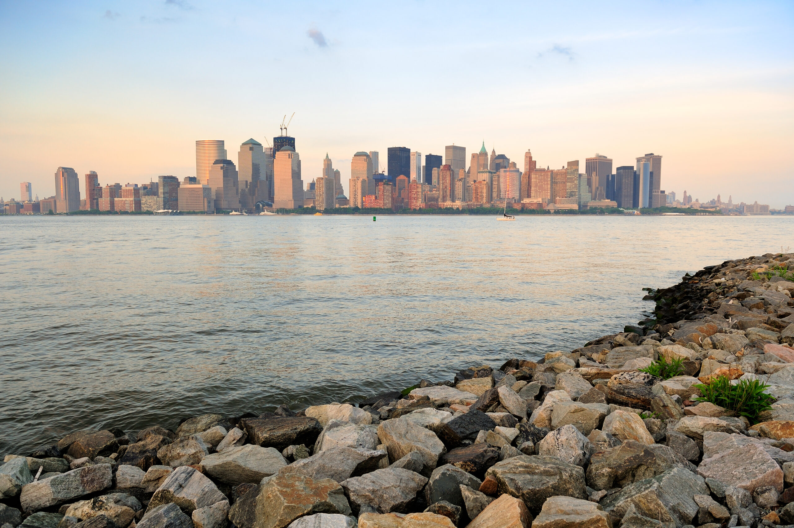 New York City skyline view from the New Jersey waterfront along the Hudson River at sunset