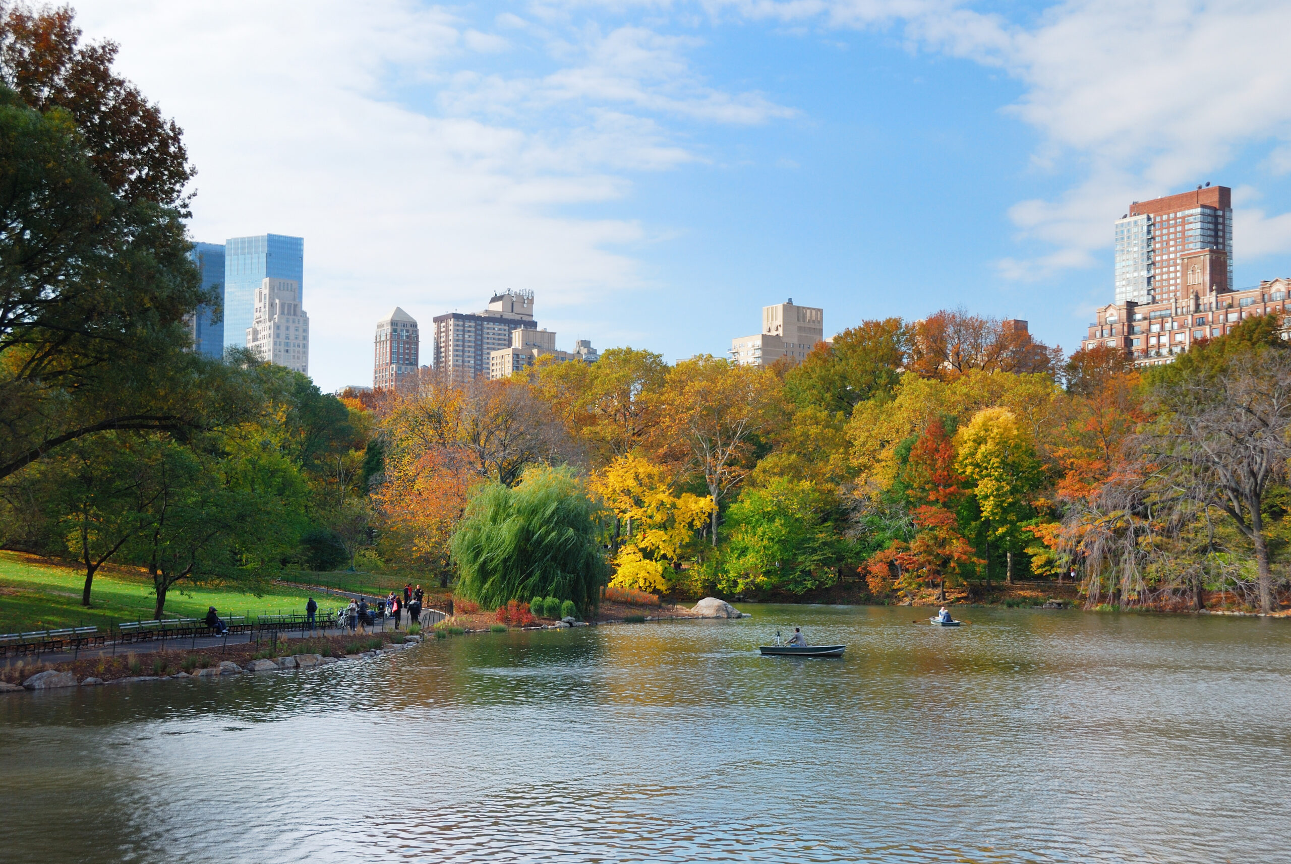 Central Park in autumn with Manhattan skyline reflected in the lake